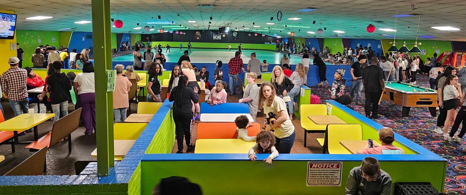 Booth seating area with the rink and arcade at Hartsville Skating Arena